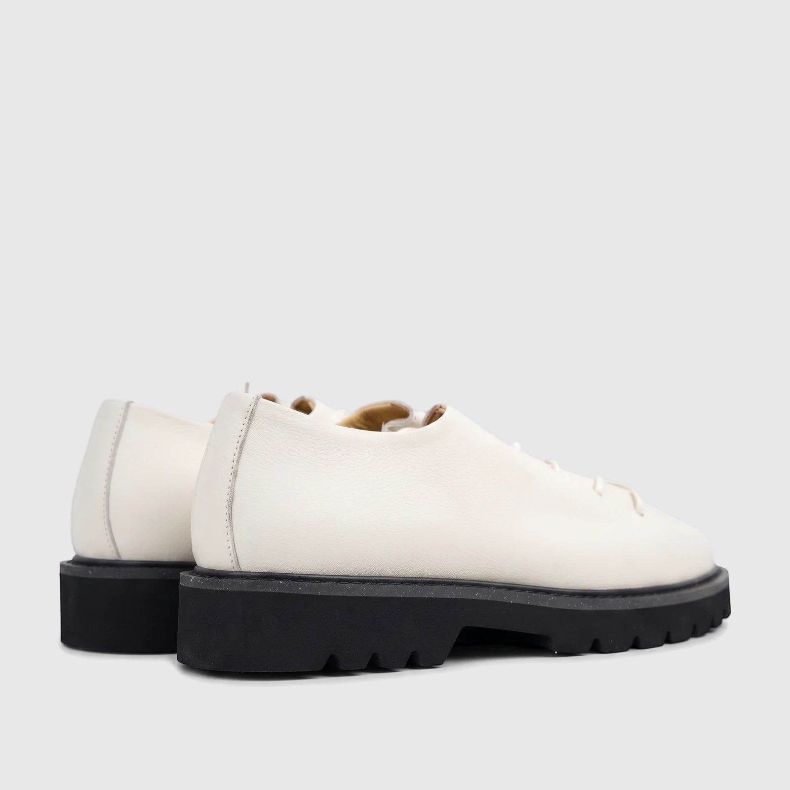 Bulletti Men's Seawolf Off White leather casual lace-up shoes with chunky black soles, shown from a rear-side view.