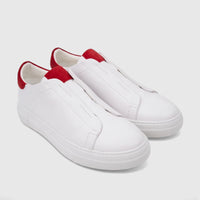 Bulletti Men's white leather slip-on sneakers with red accents, photographed at an angle.