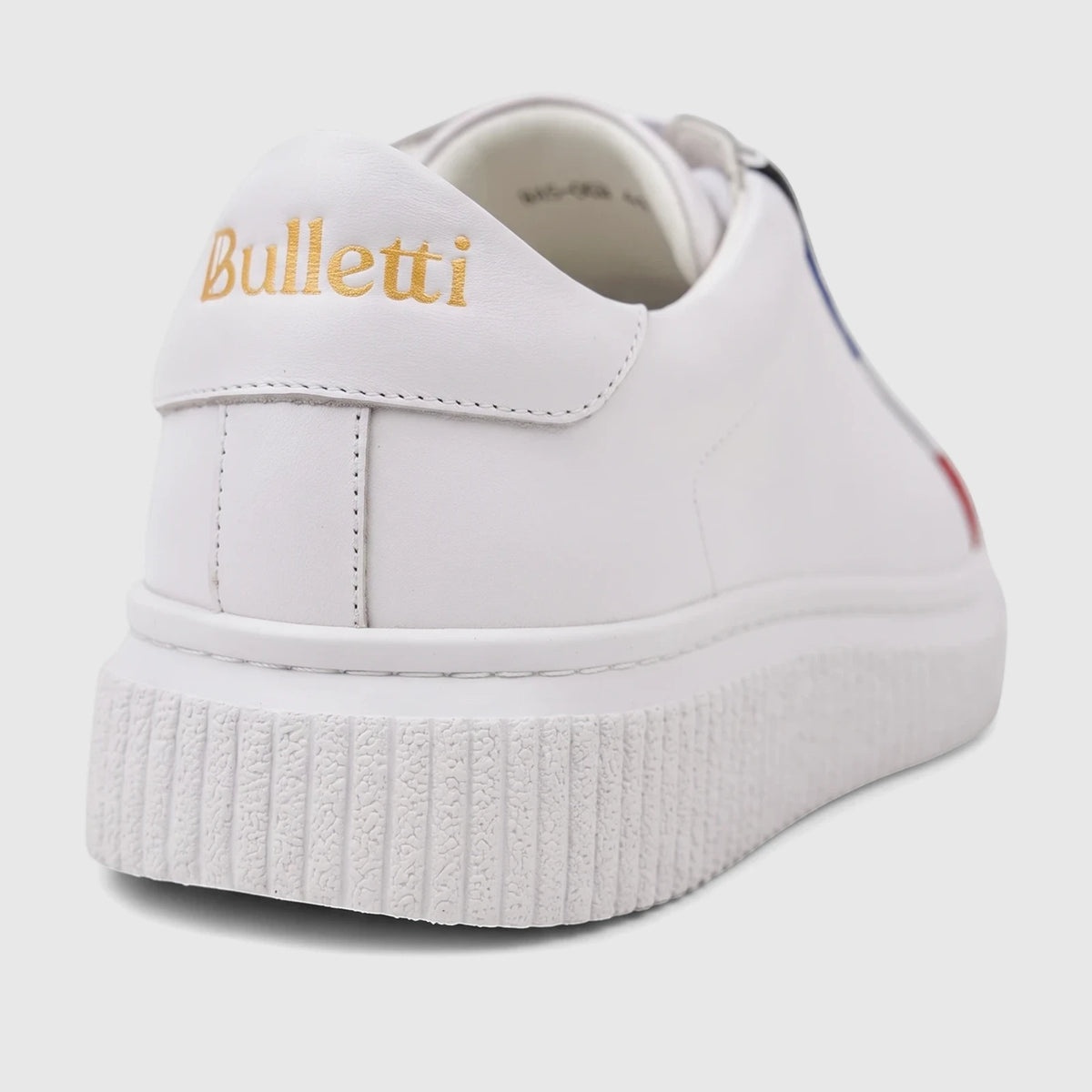 Bulletti men's white leather sneaker in a back/side view, showcasing the gold logo and textured sole.