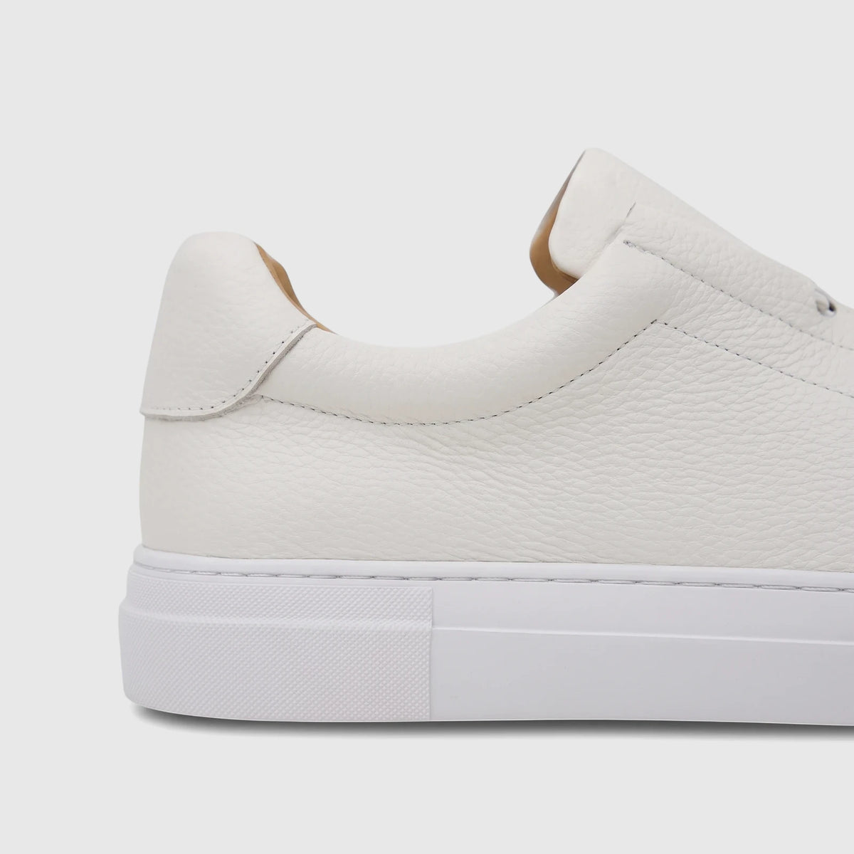 White Bulletti Men's Leather Sneaker, model HASM-006, captured in a detailed side view. The shoe features fine stitching and