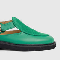 Side view of a Bulletti Unisex Majesty Green leather chunky sole sandal with green suede detailing and an antique brass