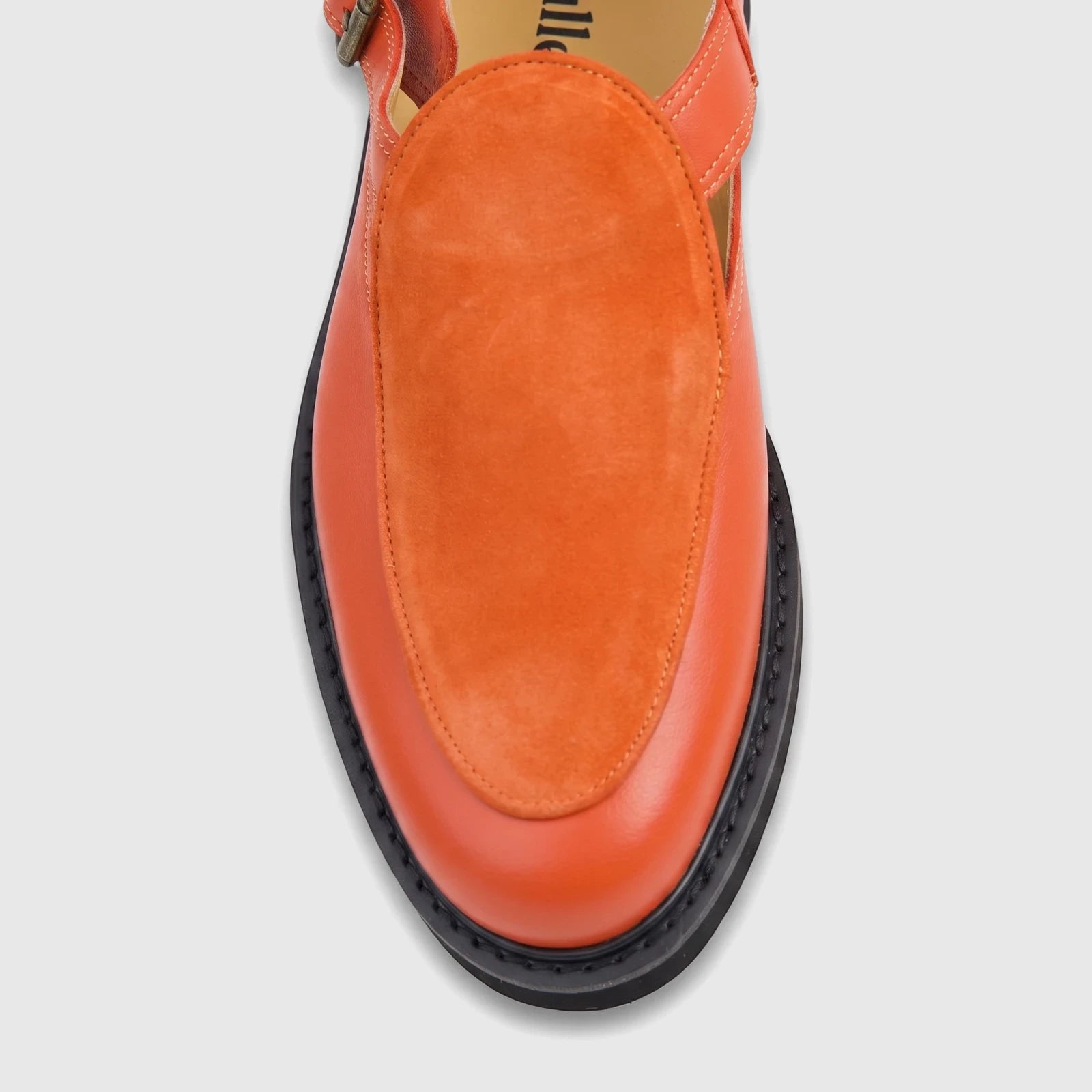 Close-up, top-down view of a Bulletti Unisex Majesty Orange Suede Chunky Sole Sandal, featuring a bright orange upper and a