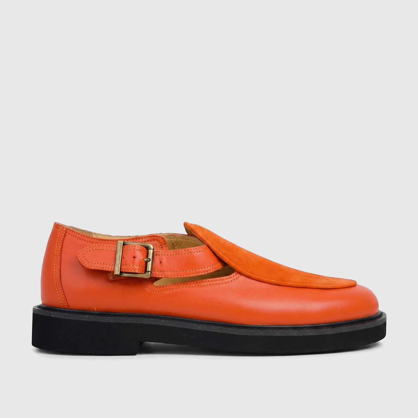 Bulletti Unisex orange leather chunky sole sandal with suede detailing and a brass buckle, shown in a side view.
