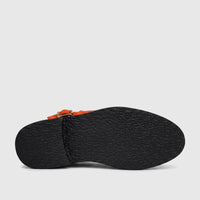 Bulletti Unisex Majesty Orange Suede Sandal with chunky black sole, viewed from the bottom.