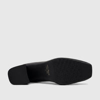 Capelli Rossi black leather block heel court shoe, bottom view showing textured sole and heel.