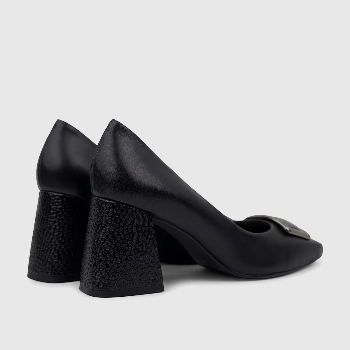 A pair of black leather Capelli Rossi block heel court shoes with a silver buckle detail, viewed from the side.