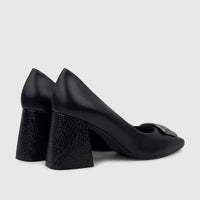 A pair of black leather Capelli Rossi block heel court shoes with a silver buckle detail, viewed from the side.