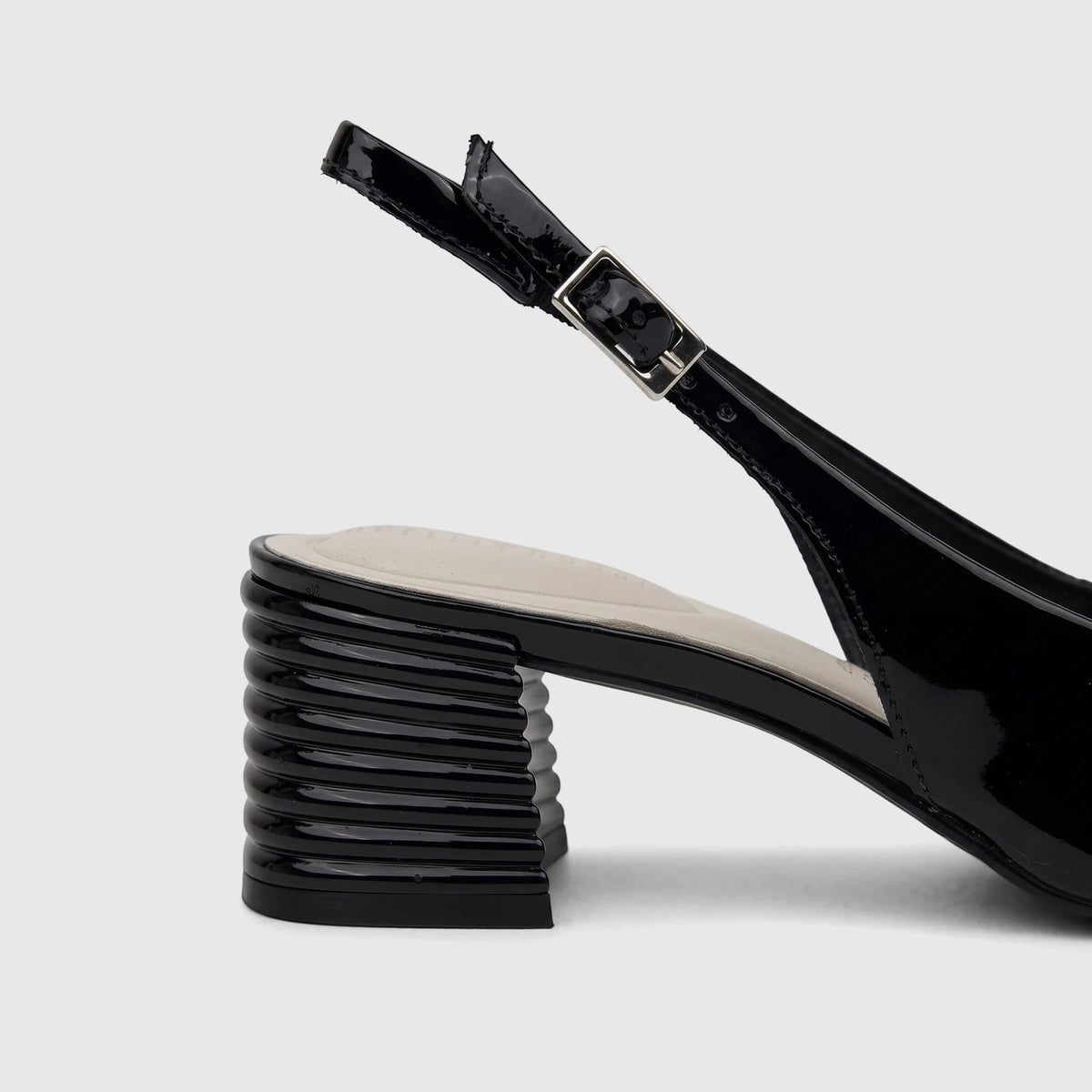 Capelli Rossi black patent leather ladies slingback court shoe with a structured block heel, shown in a side view.
