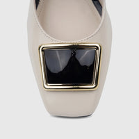 Close-up of a Capelli Rossi ladies' bone leather shoe, featuring a square toe and a prominent rectangular gold-framed black