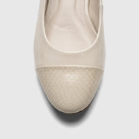 Close-up front view of a bone Capelli Rossi ladies' flat shoe featuring a shiny patent leather upper and a textured