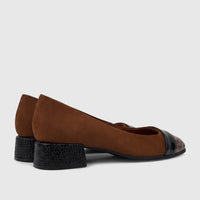 A pair of Capelli Rossi brown leather block heel court shoes with a black patent leopard print toe and textured heels.