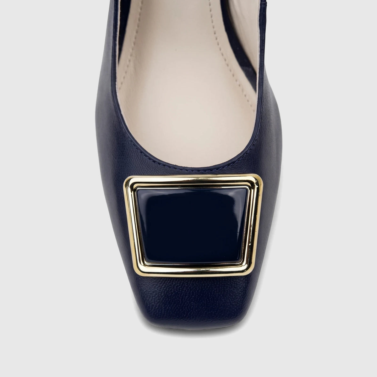 Close-up of a deep blue leather Capelli Rossi ladies' slingback block heel court shoe with a gold and navy rectangular