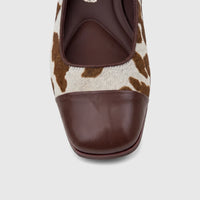 Front view of a Capelli Rossi Ladies Block Heel Court shoe featuring a brown cow print fur upper and a brown leather square