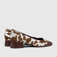 Capelli Rossi Ladies Block Heel Court Shoes, featuring a brown and white cow hair print with a brown cap toe and block heel,