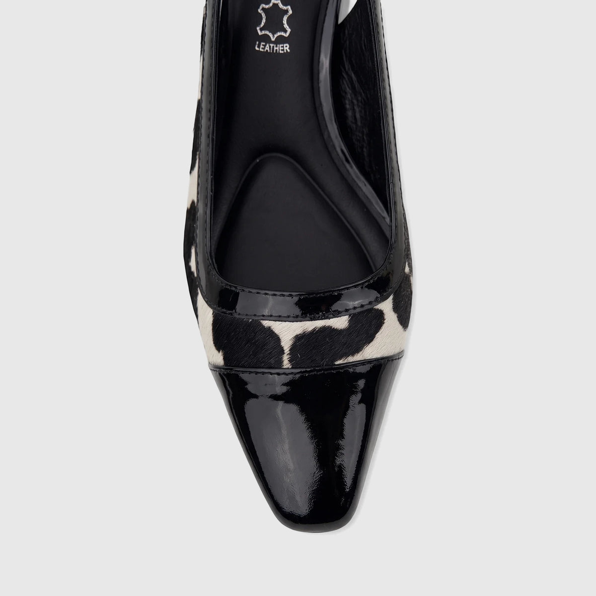 Close-up of a Capelli Rossi ladies' slingback block heel court shoe in black cow hair with a patent leather toe cap.