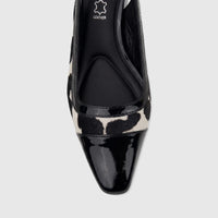 Close-up of a Capelli Rossi ladies' slingback block heel court shoe in black cow hair with a patent leather toe cap.