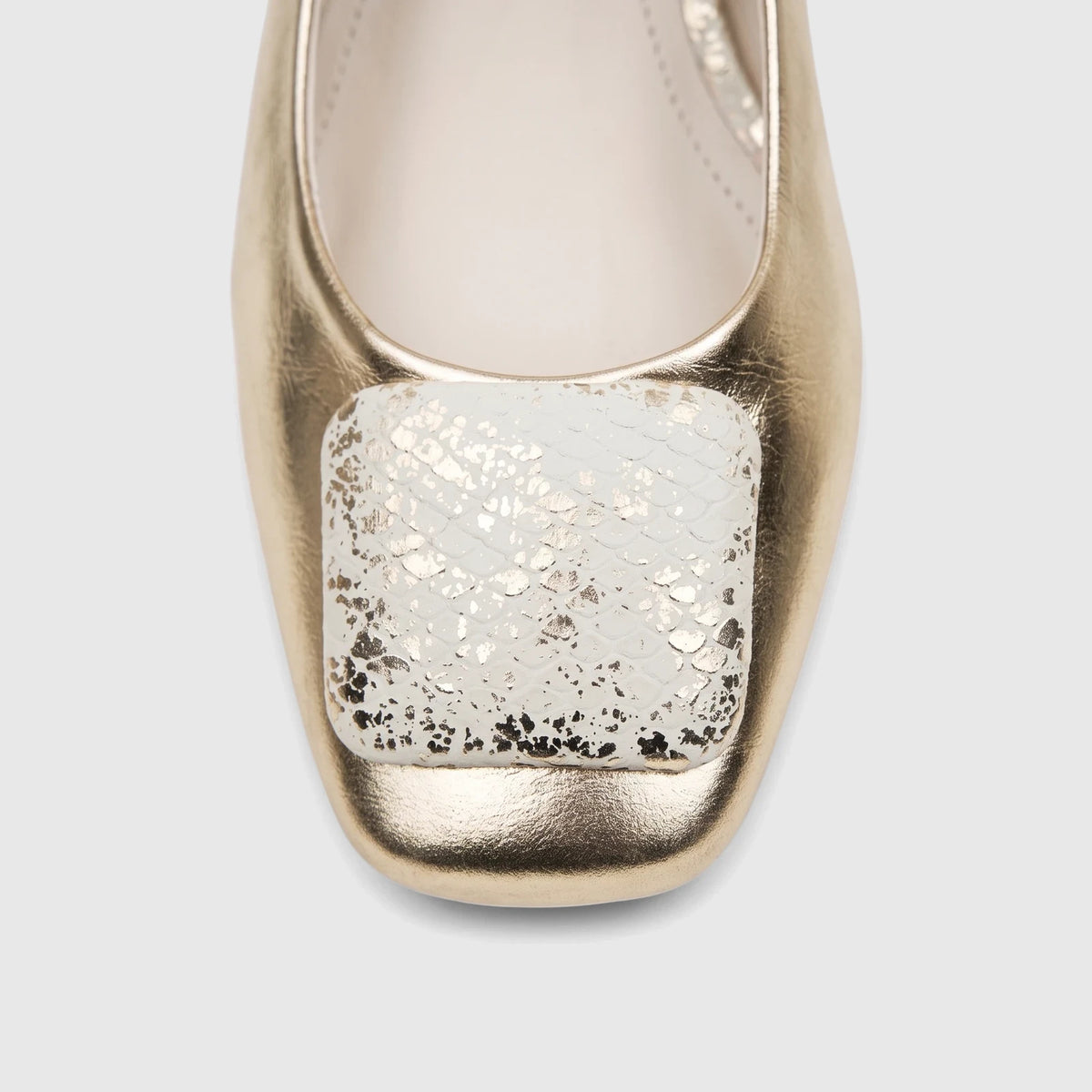 Close-up of a Capelli Rossi Ladies Slingback Block Heel Court shoe in light gold leather, featuring a square toe and a