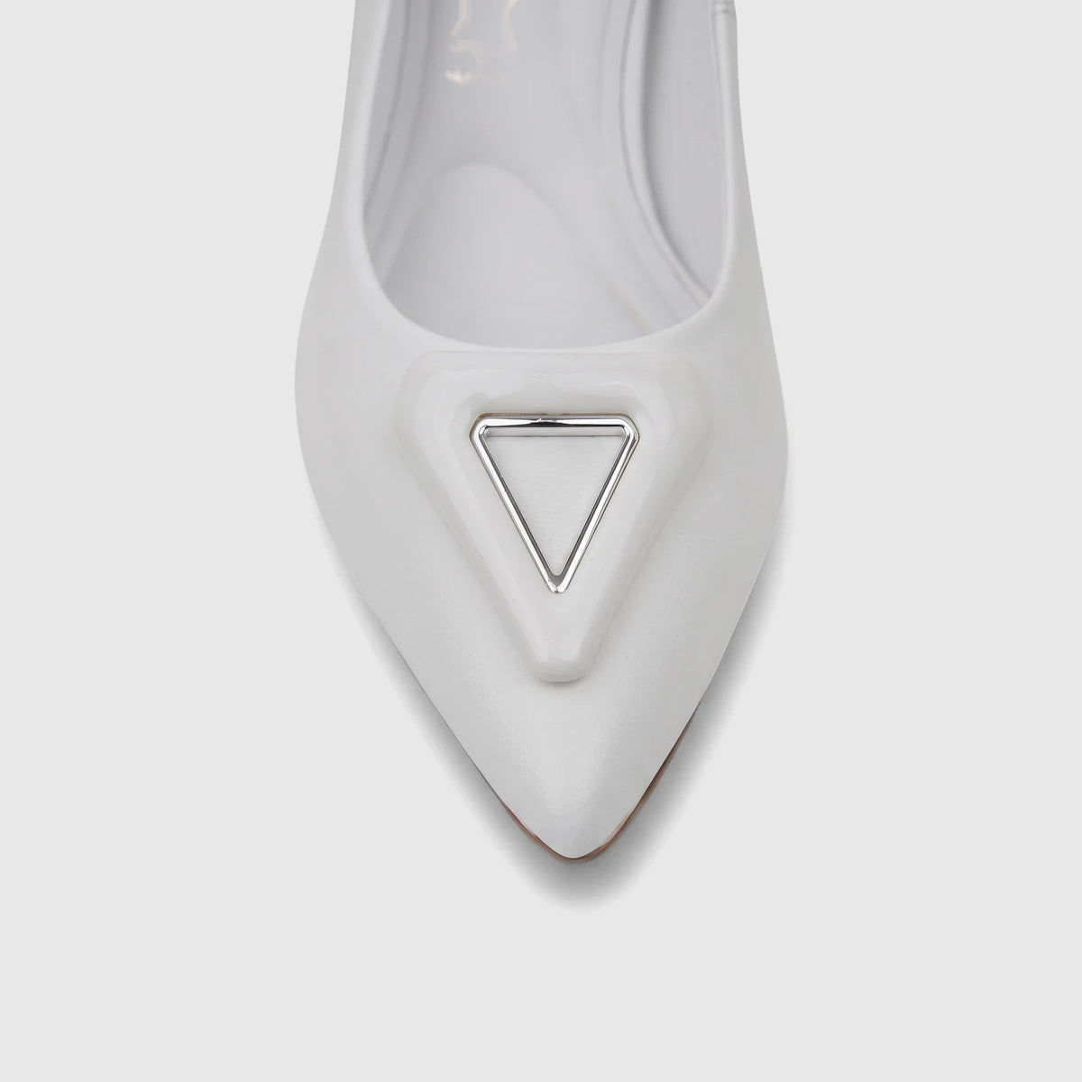 Close-up of a white Capelli Rossi leather ladies block heel court shoe, featuring a pointed toe and a silver triangular