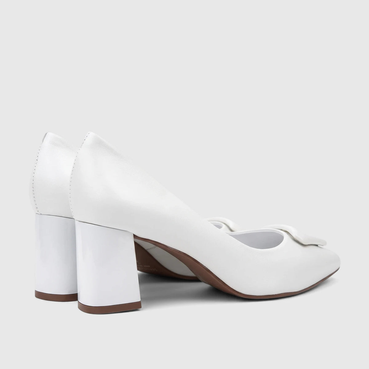 Capelli Rossi white leather ladies' block heel court shoes, captured from a side-rear perspective, emphasizing the block