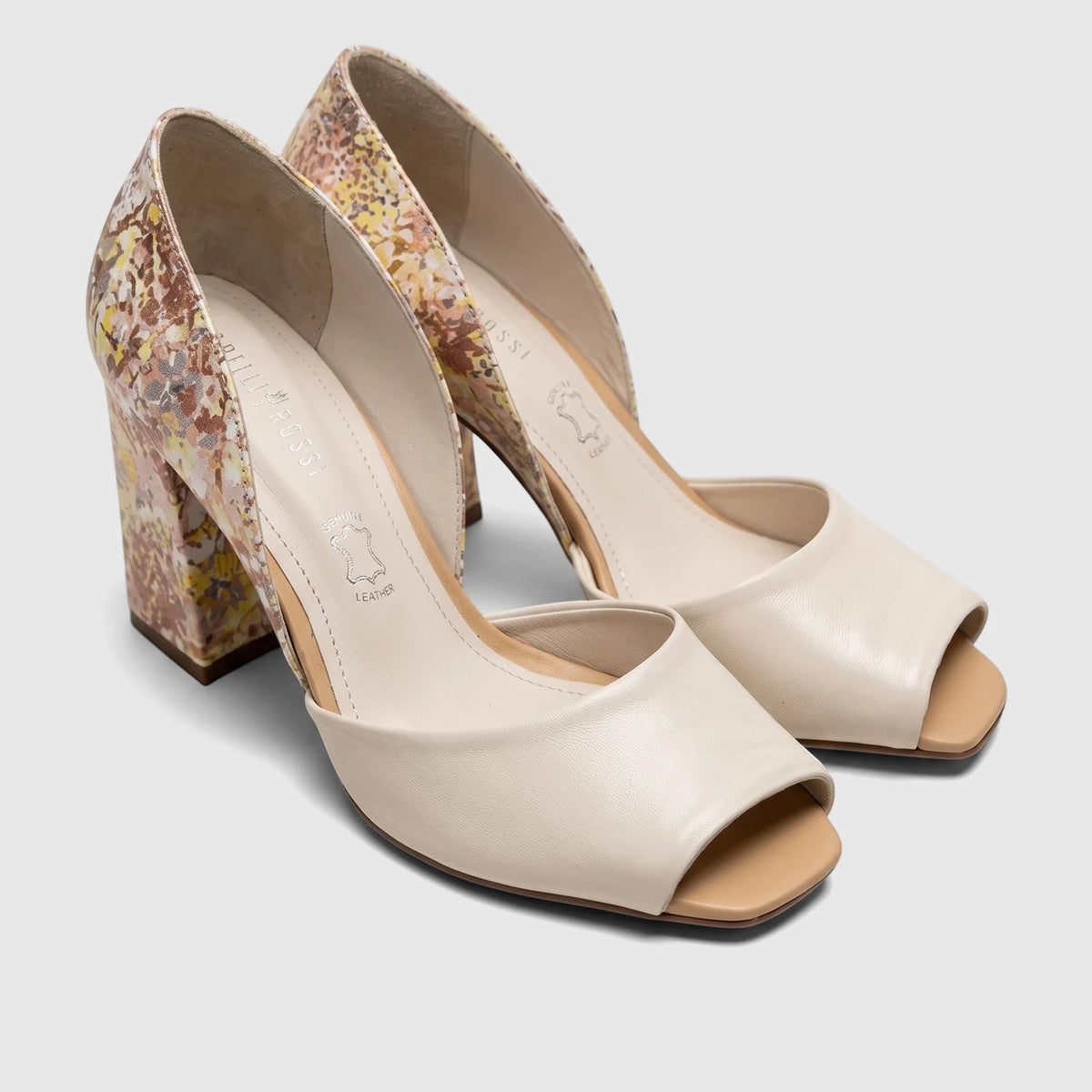 A pair of Capelli Rossi leather ladies block heel peep-toe court shoes in beige with a floral patterned heel.