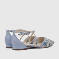 Two blue Capelli Rossi Leather Ladies Pumps, featuring a floral pattern and elegant ankle straps, from a side-back view.