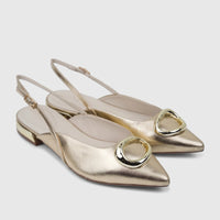 A pair of light gold Capelli Rossi leather ladies pumps featuring pointed toes, slingback straps, and prominent irregular