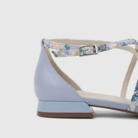 Light blue leather ladies' sandal with a delicate floral ankle strap and a small block heel, shown from a side perspective.