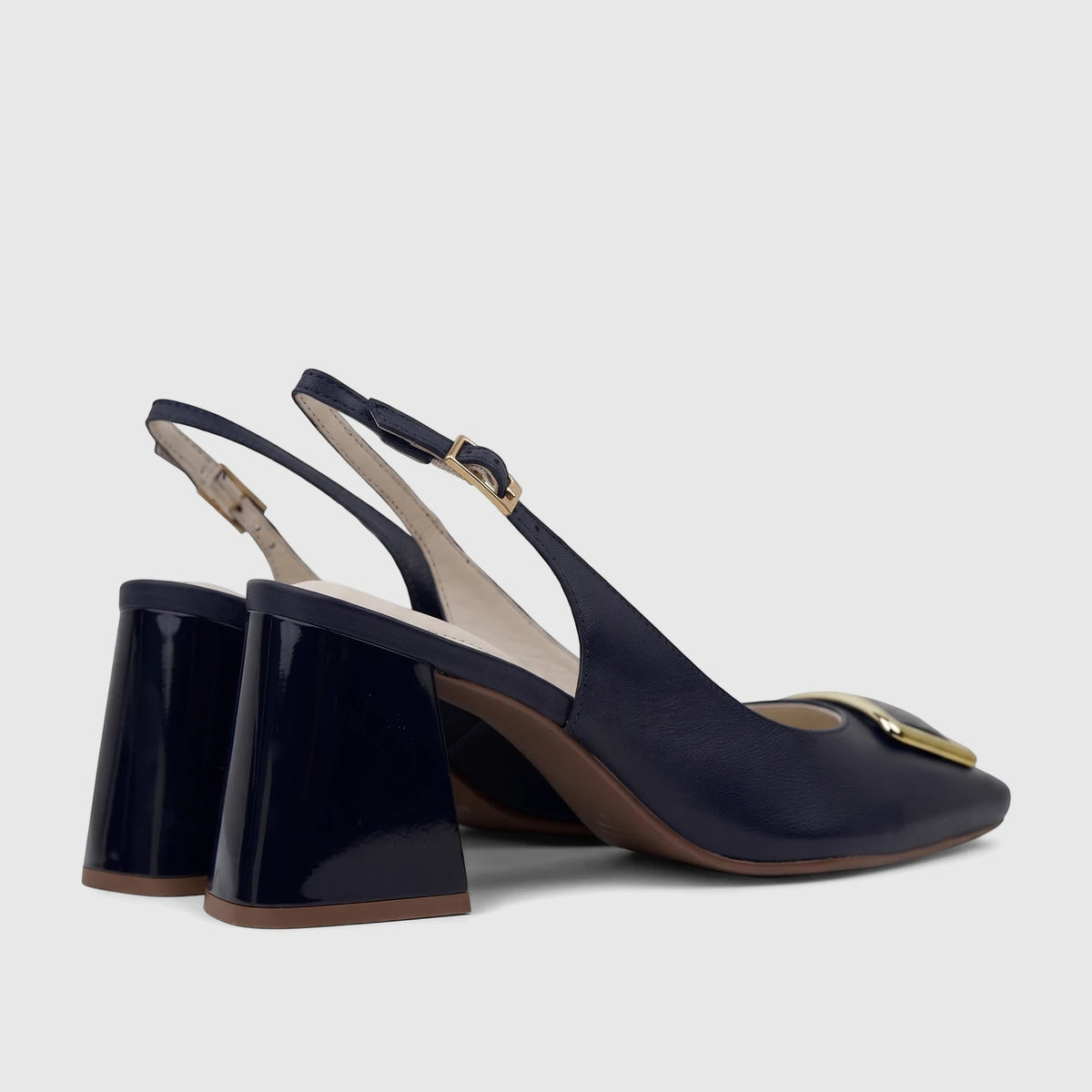 Deep blue leather Capelli Rossi ladies' slingback block heel court shoes with elegant gold buckles, viewed from the side.