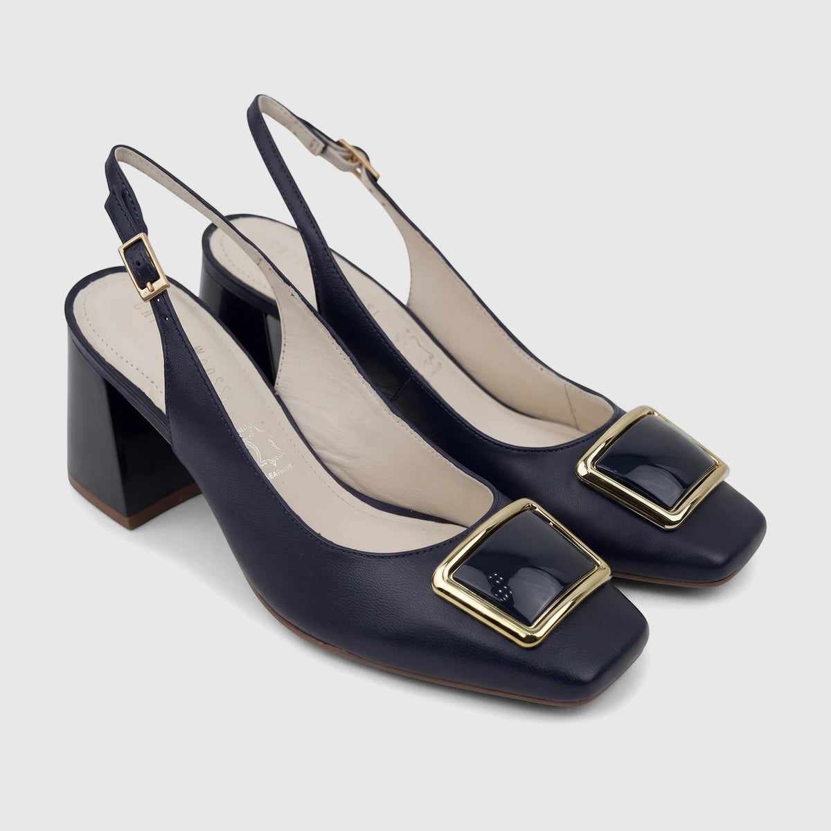 Deep blue Capelli Rossi leather ladies slingback court shoes with a block heel, square toe, and gold buckle detail.