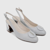 Pair of Capelli Rossi powder blue leather slingback block heel court shoes, with reflective heels and silver-toned hardware.