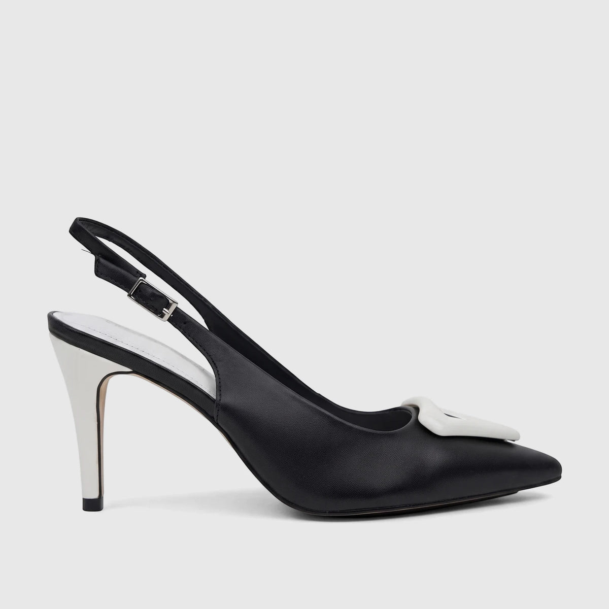 Black Capelli Rossi leather ladies slingback court shoe with a pointed toe, white stiletto heel, and a white embellishment,
