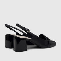 Black leather Capelli Rossi slingback block heel court shoes with a braided vamp and silver buckle, shown from a side angle.