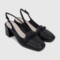 Pair of black leather Capelli Rossi slingback block heel court shoes with square toe and chain detail, viewed from an angled