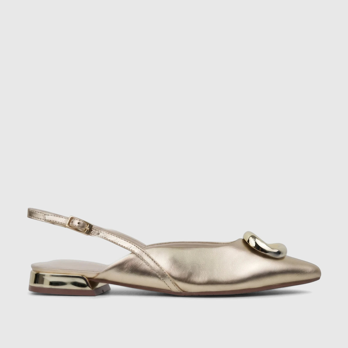 Light gold Capelli Rossi leather ladies pump with a pointed toe, slingback strap, low heel, and sculptural gold ornament.