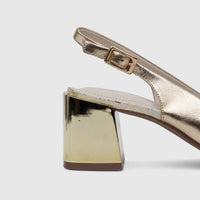 Capelli Rossi light gold leather slingback court shoe with a block heel, visible from the side.