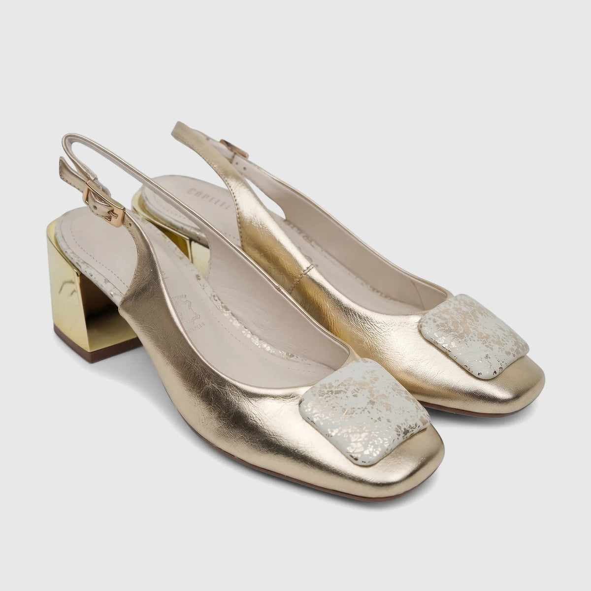 Capelli Rossi Light Gold leather slingback block heel court shoes with decorative square buckles on a white surface.