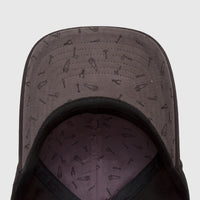 Underside view of a Cat Design Mark Aop Cap, black with a grey lining patterned with various hand tools.