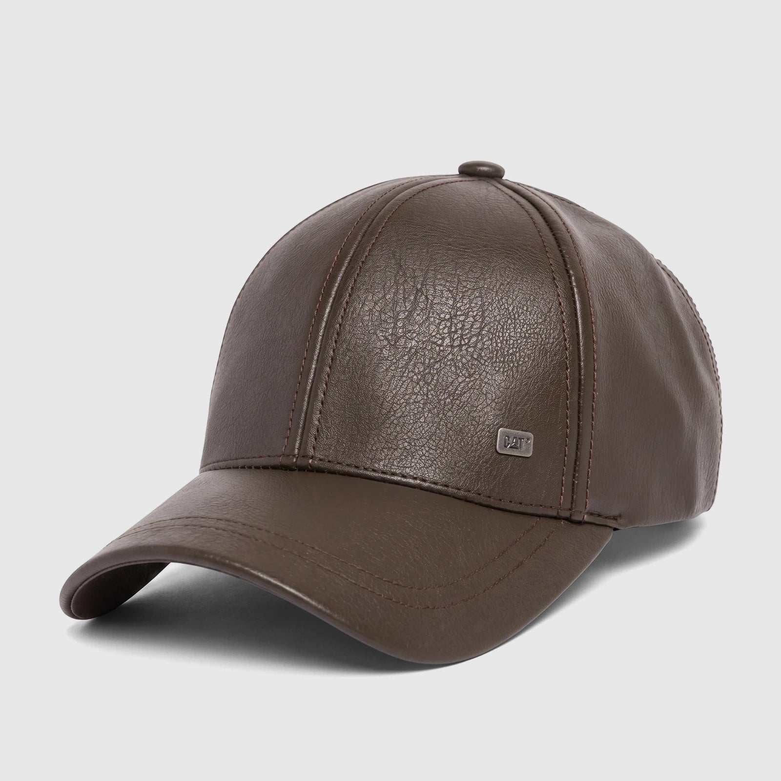 Brown Cat Faux Leather Heritage Hat, viewed from a slight angle, showcasing its textured surface and logo detail.