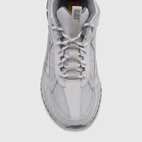 Front view of a Cat Men's Amperage P726915 sneaker in glacier grey, featuring mesh and leather panels with visible laces and