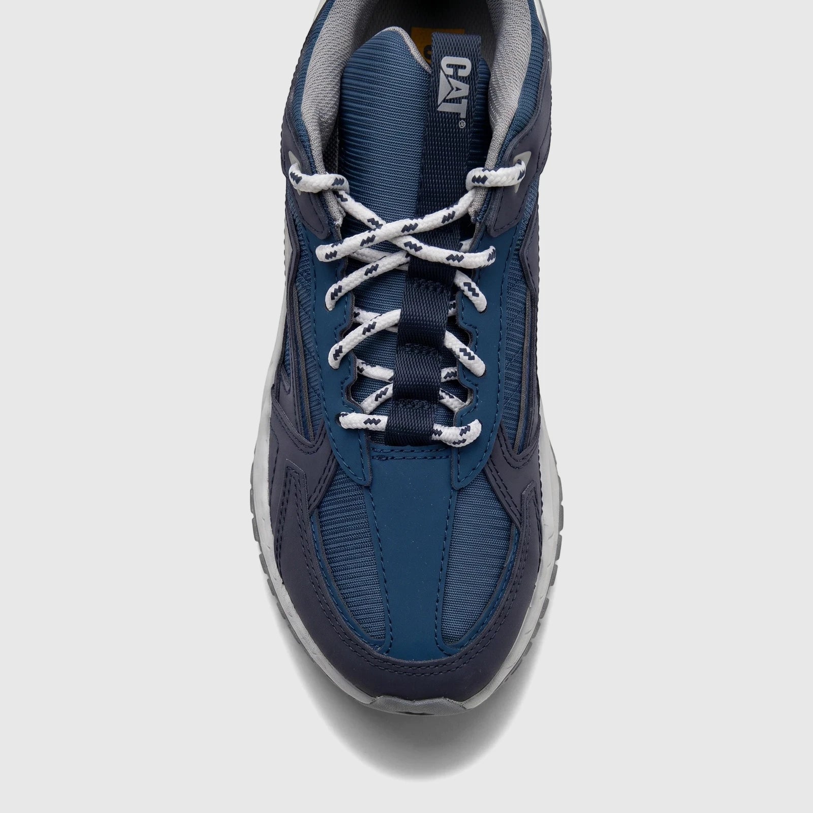 Top-down view of a Cat Men's Amperage P726916 sneaker in navy blue, featuring white laces and visible branding.