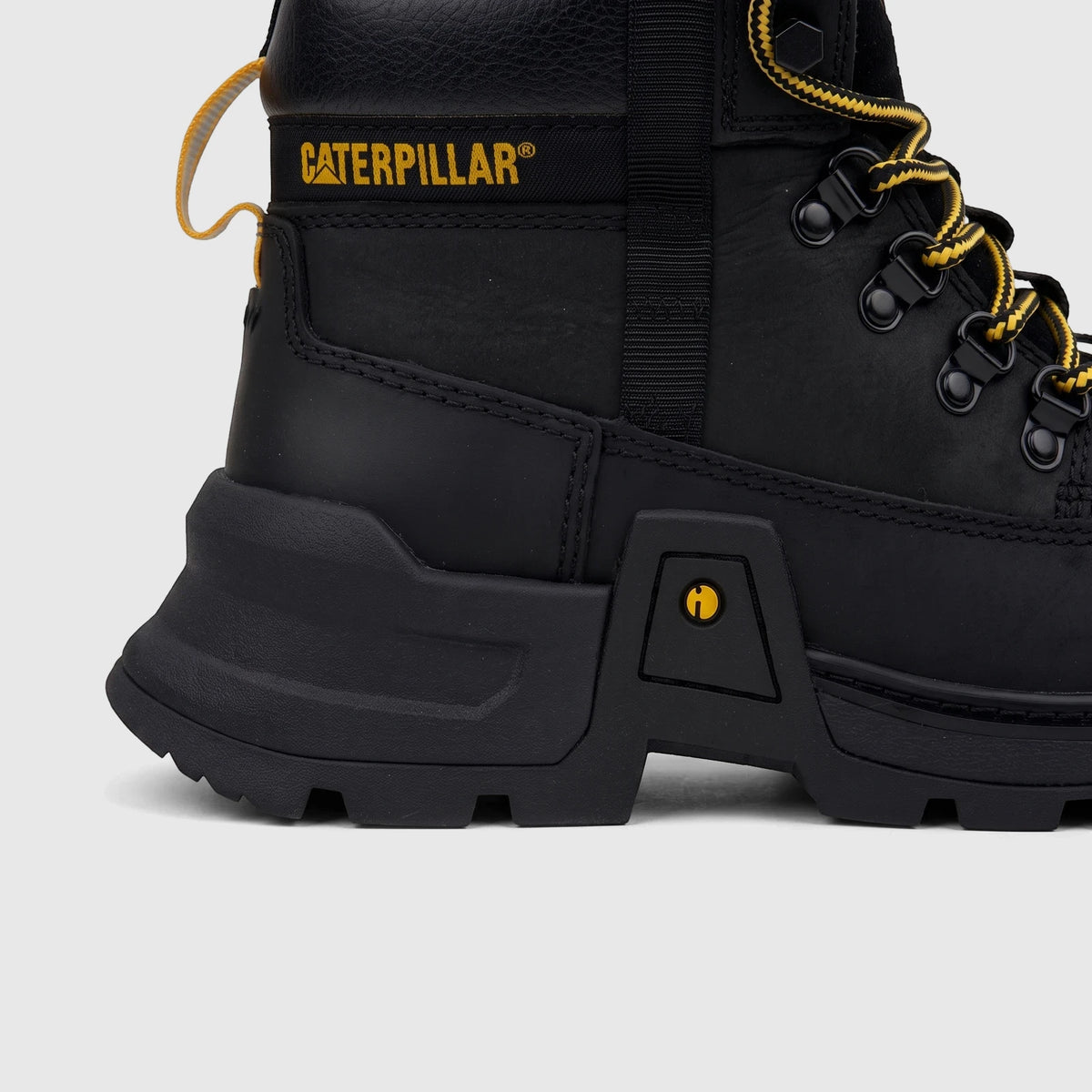 Close-up side view of a black Cat Men's Colorado Expedition Hiker boot with yellow laces and a yellow logo.