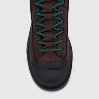 Men's Cat Colorado Expedition Hiker boot in dark chocolate brown leather with teal laces, front view.