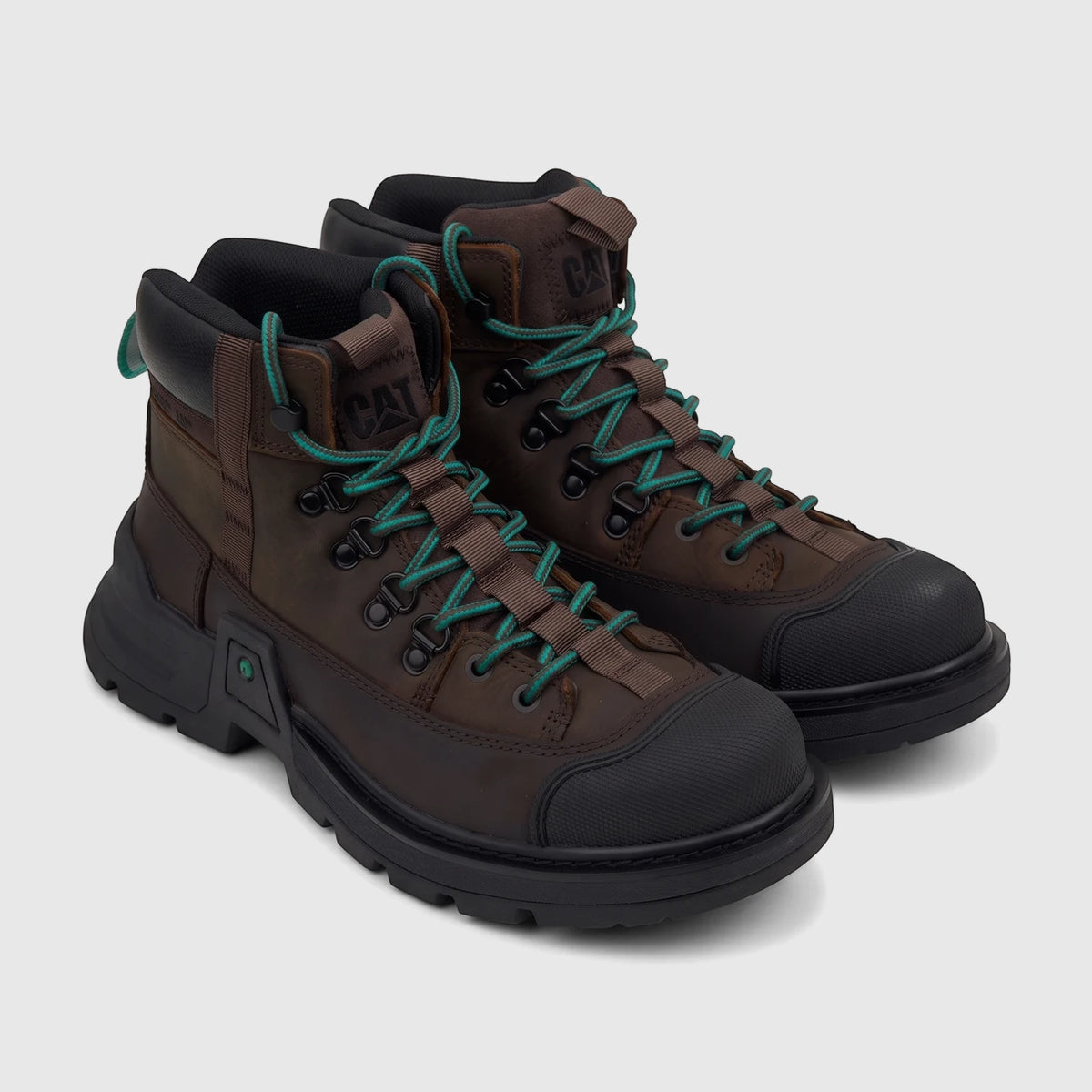 A pair of dark chocolate brown Cat Men's Colorado Expedition Hiker P727018 boots with vibrant green laces and black soles,