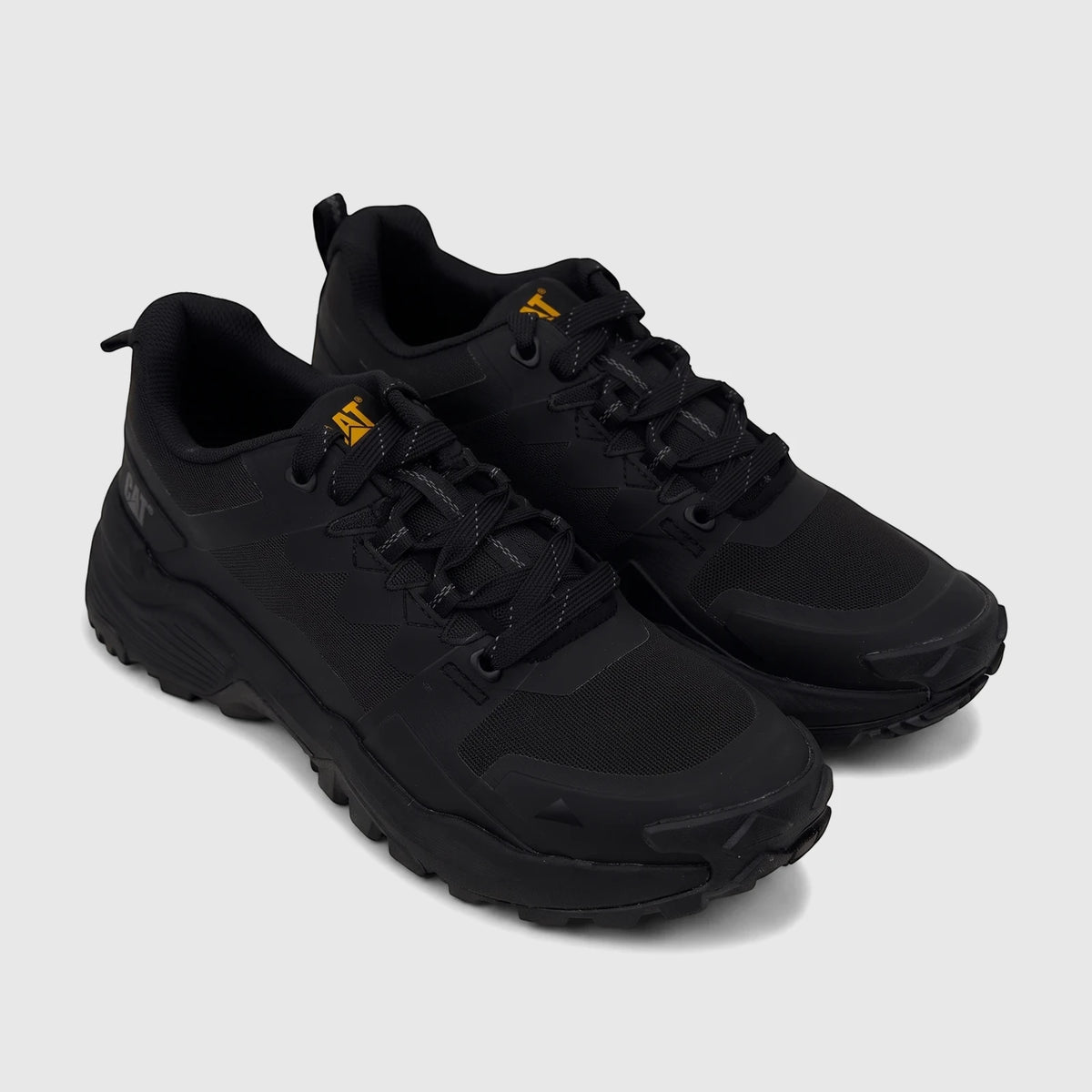A pair of black Cat Men's Grapple No Sew trail running shoes, featuring mesh and synthetic uppers with yellow logos.