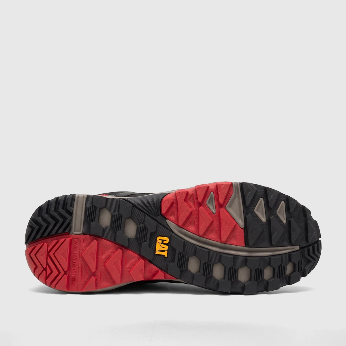 Close-up view of the black and red sole of a Cat Men's Grapple No Sew P726821 Total Eclipse CT425 shoe with yellow CAT logo.