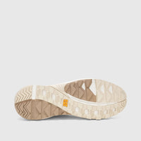 Cat Men's Grapple No Sew sneaker in Whisper White and beige, sole view showcasing the tread pattern and branding.