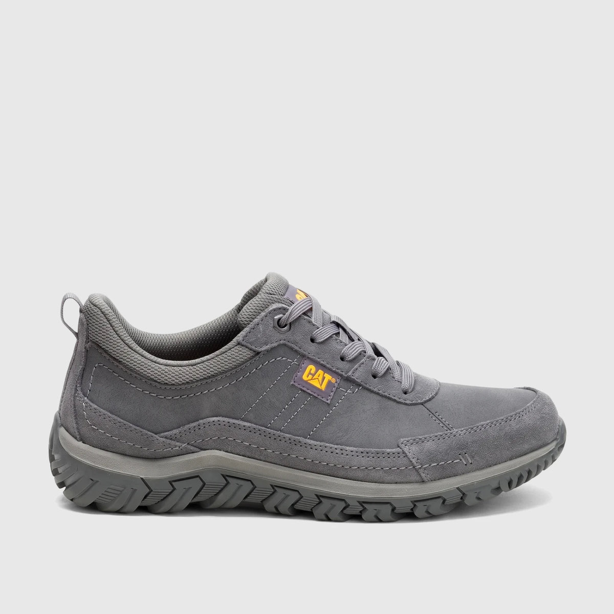 Gray Cat Men's Press Lo P727274 casual shoe, shown in side profile with a textured sole and yellow brand logos.