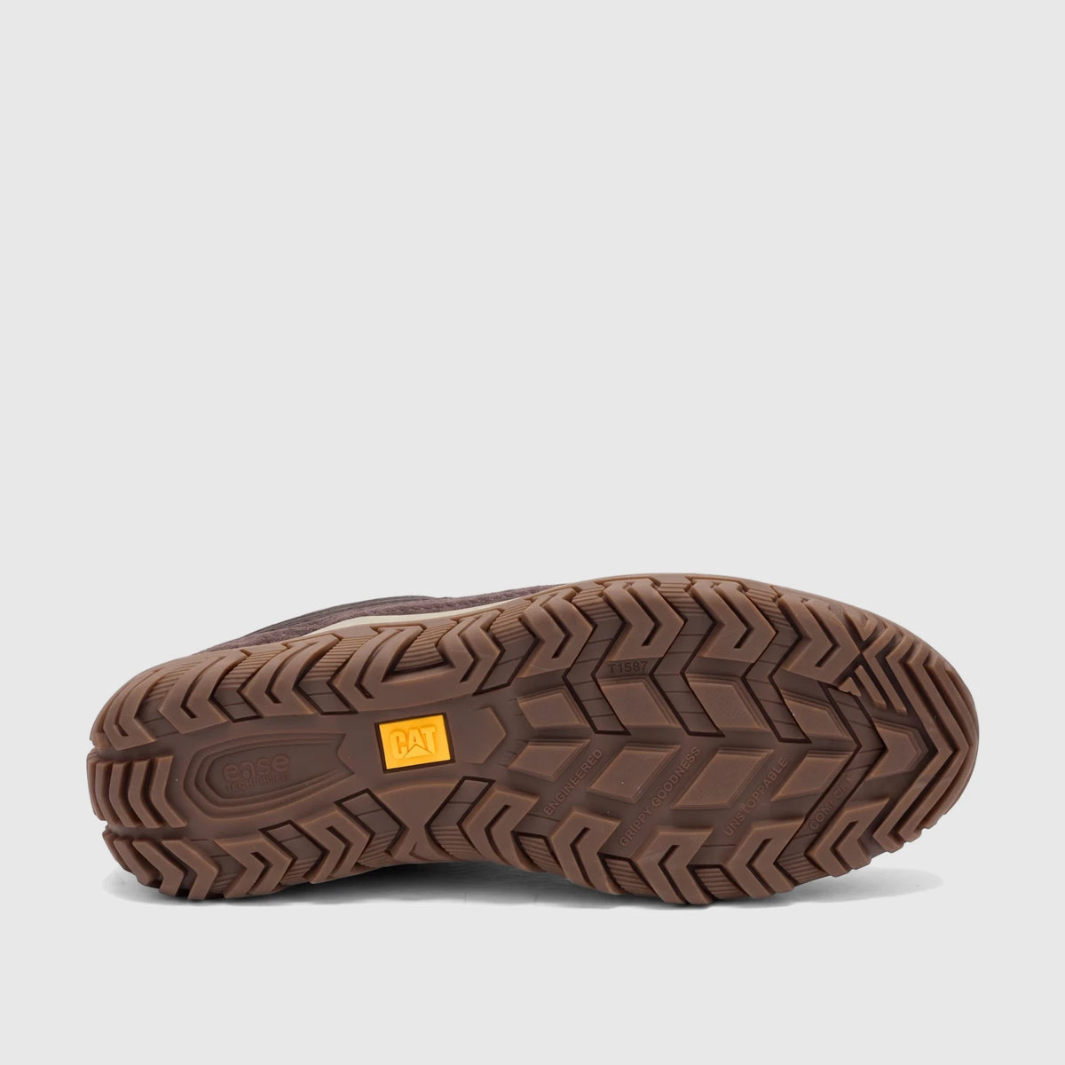 Underside view of the brown Cat Men's Press Lo P727275 shoe sole, highlighting its textured tread and brand logos.