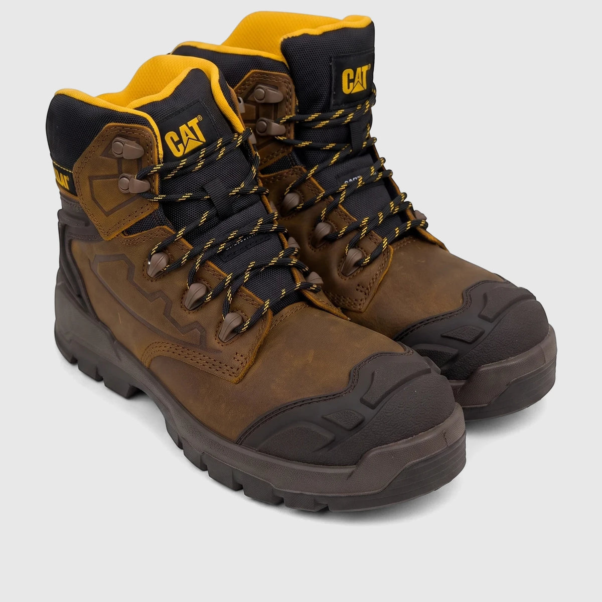 A pair of Cat Men's Striver XL 6-inch safety boots in dark beige/brown leather with black accents and yellow laces, viewed