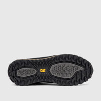 Bottom view of a black Cat Men's Trigen P726923 shoe, showcasing its durable lugged sole with gray hexagonal patterns and